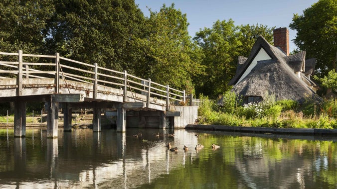A cottage next to a bridge over the River Stour at Flatford, Suffolk